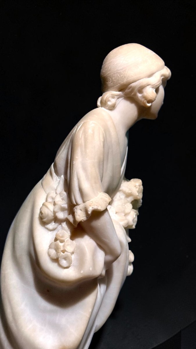 Statue Depicting A Little Girl With Flowers -photo-2