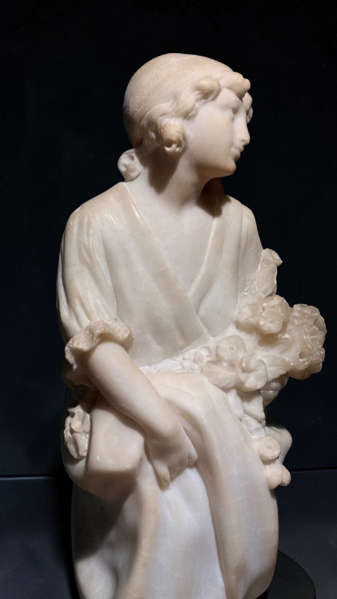 Statue Depicting A Little Girl With Flowers -photo-3