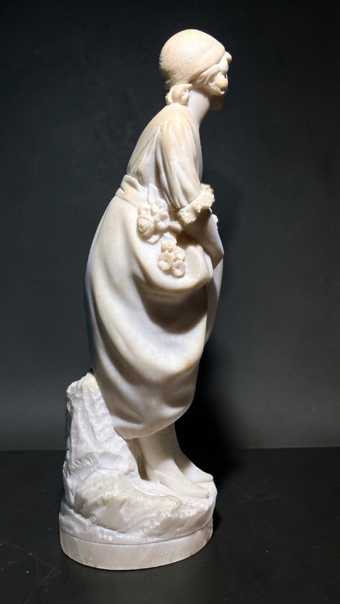 Statue Depicting A Little Girl With Flowers -photo-5
