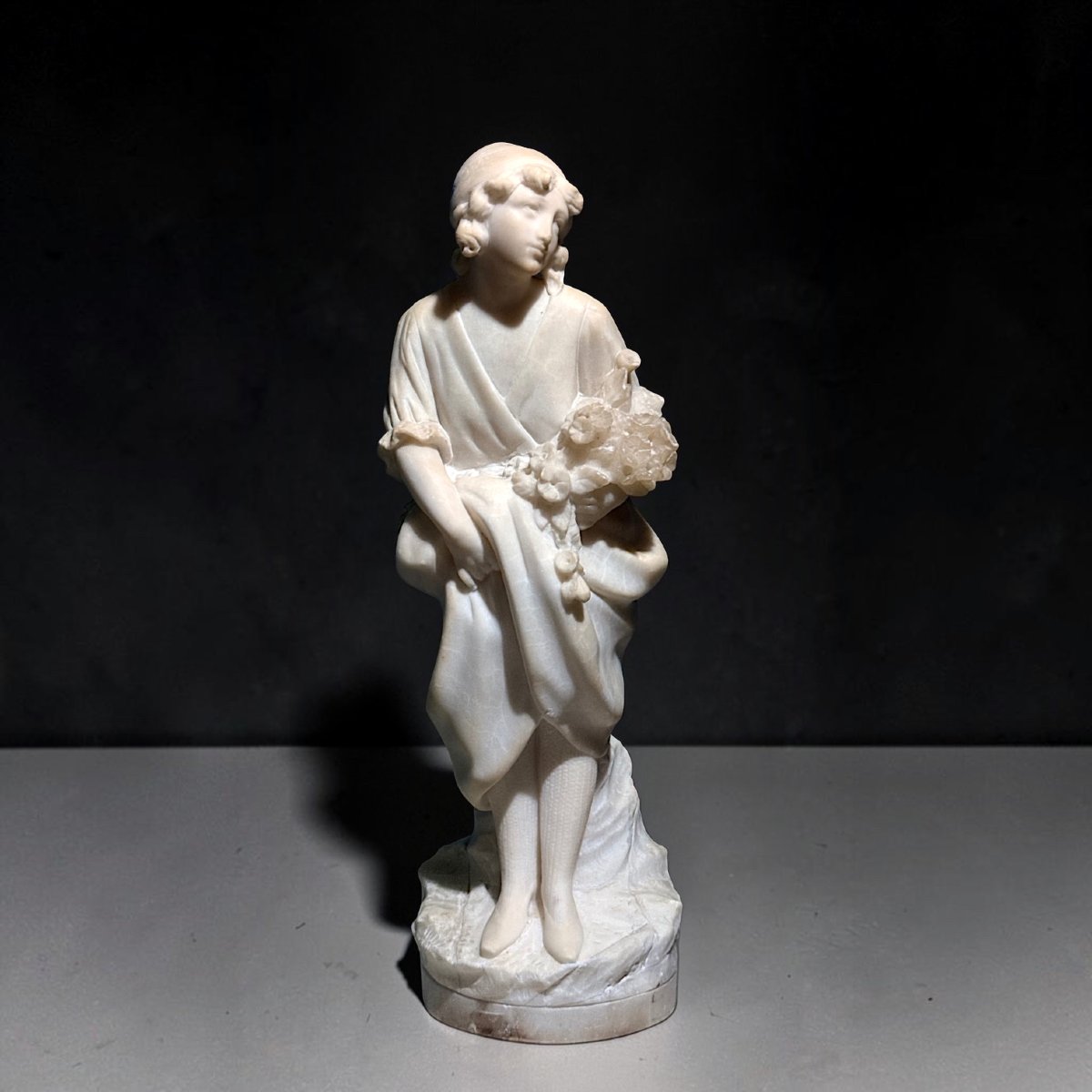 Statue Depicting A Little Girl With Flowers -photo-6
