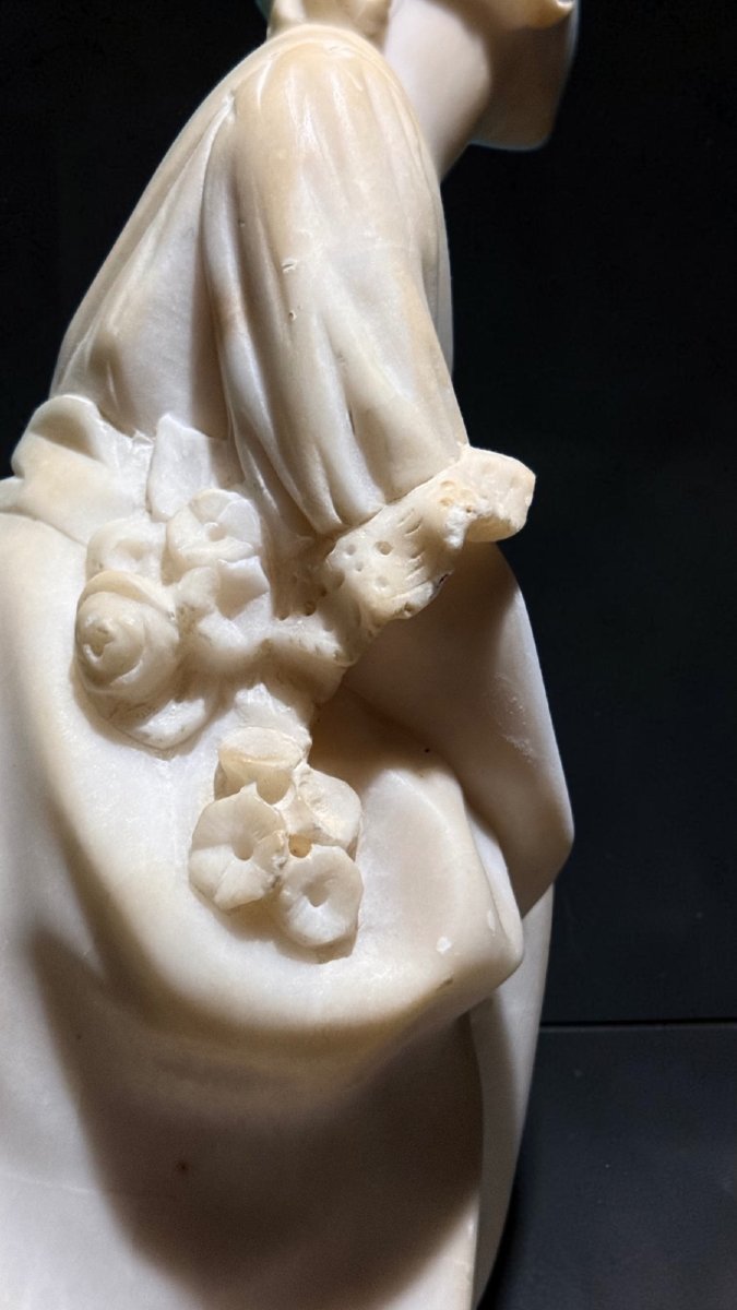 Statue Depicting A Little Girl With Flowers -photo-8