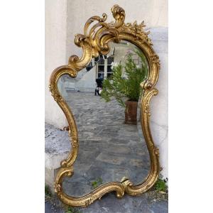 Miroir Rocaille en bois sculpté et doré