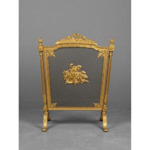 Pare feu ancien de cheminée en bronze doré style Louis XVI réalisée à la fin du XIXème siècle  