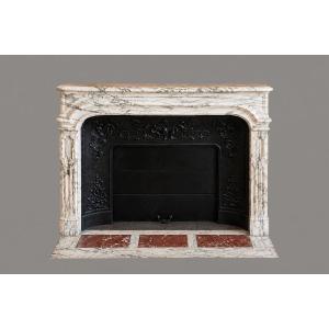 Cheminée ancienne de style régence réalisée en marbre Brèche Violette datant du XIXeme siècle