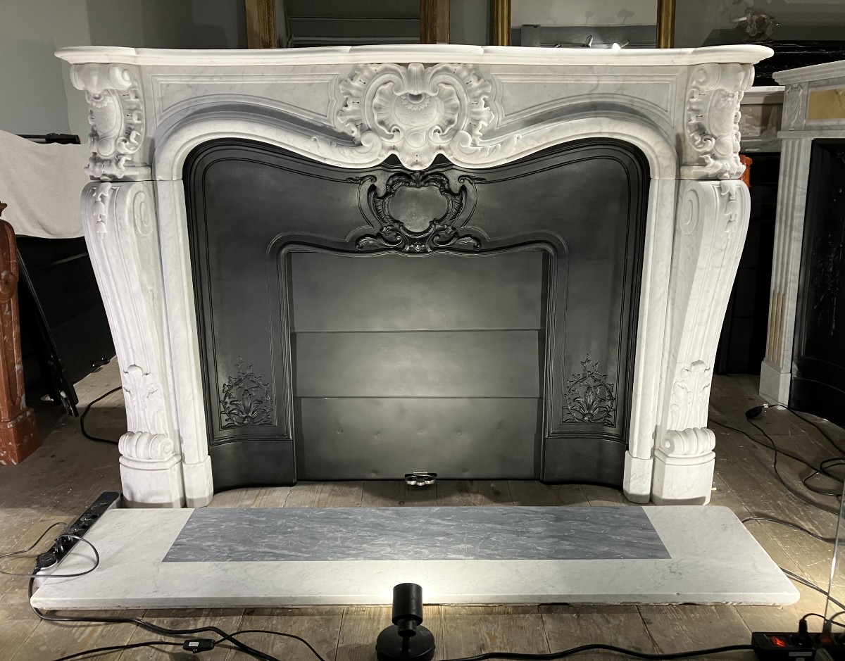 Large Louis XV Style Fireplace In White Veined Marble.