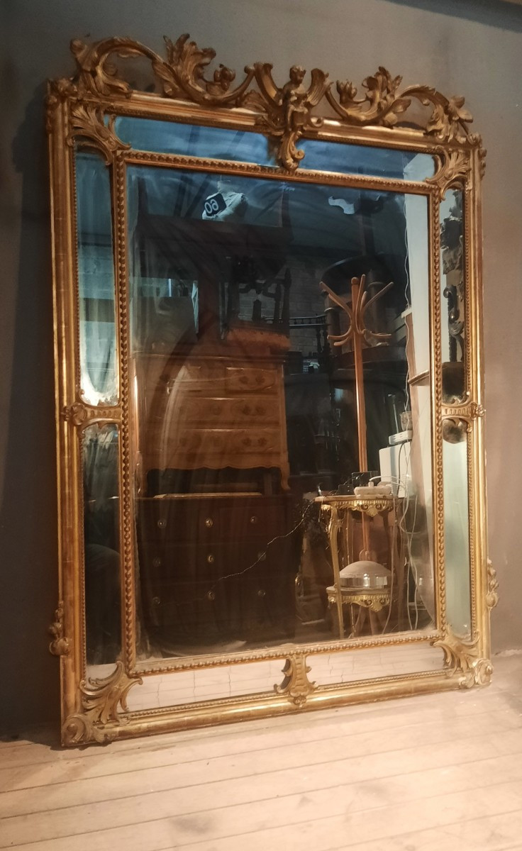 Grand mirroir doré à parre closes 
