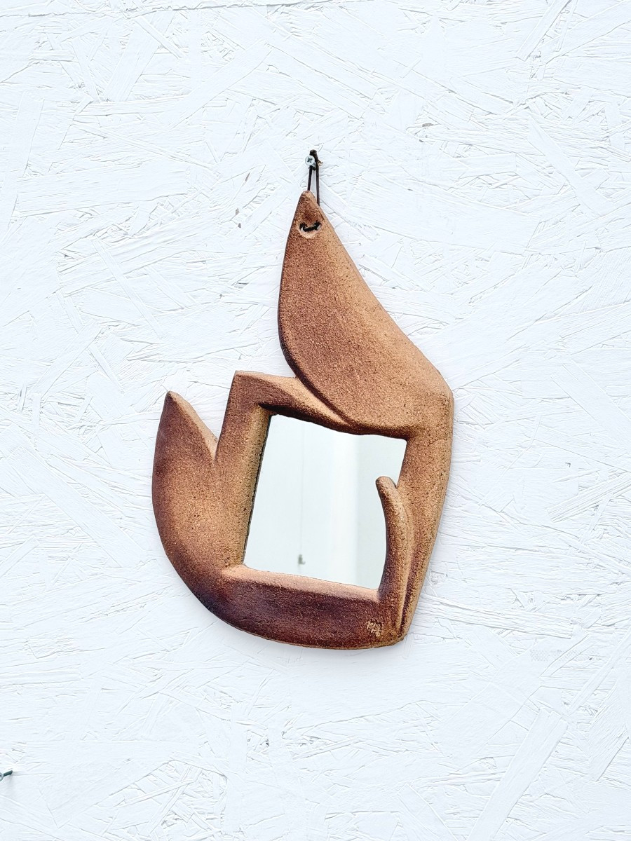 Miroir mural en céramique signé