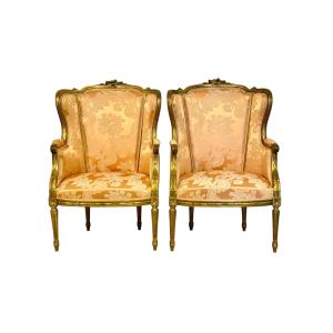 Paire de bergères en bois doré de style Louis XVI, fin du XIXe siècle
