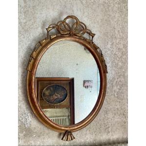 Louis XVI Style Oval Mirror From The 19th Century In Golden Wood.