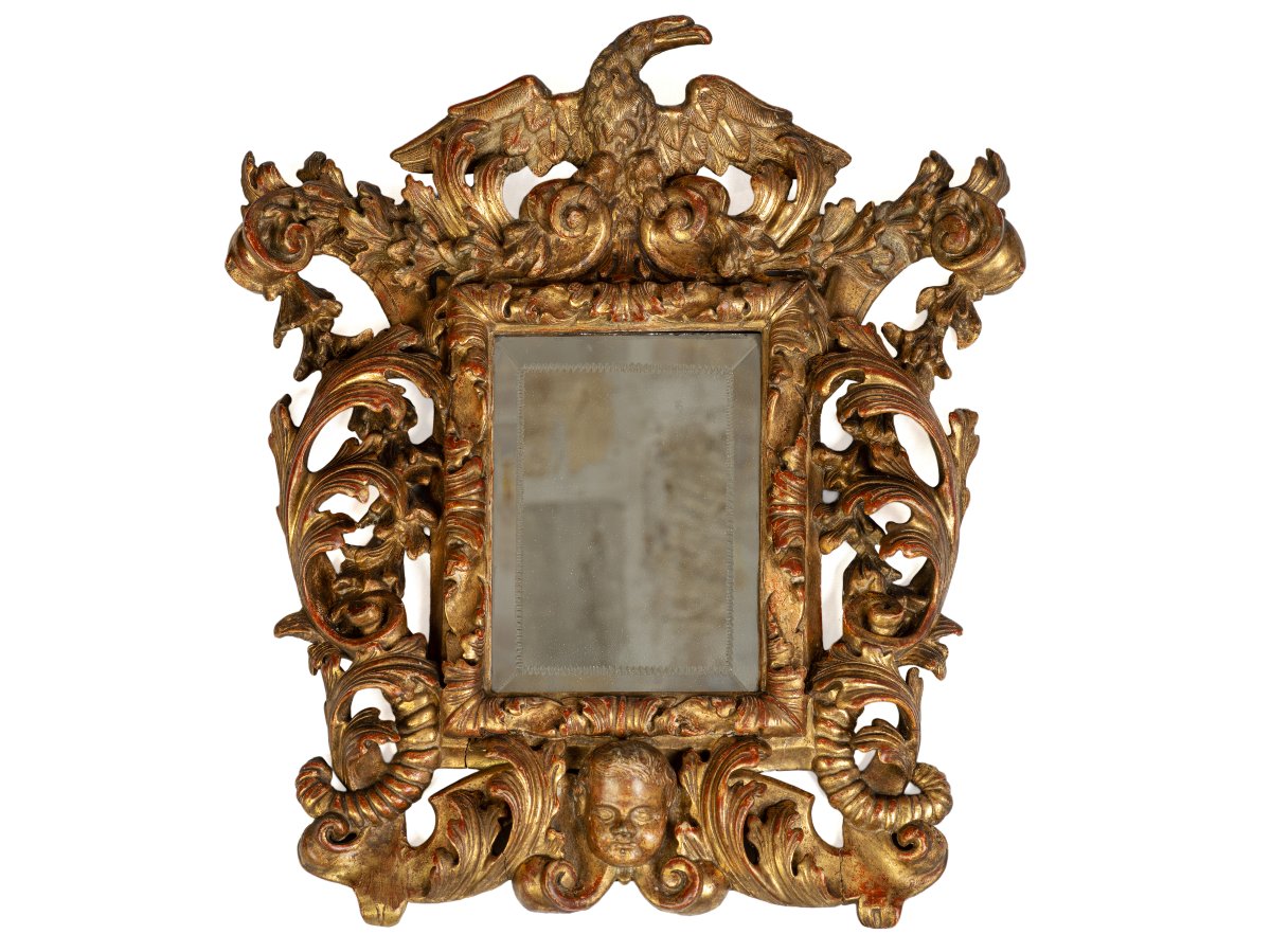 Miroir Italien en bois doré du XVIIe siècle.
