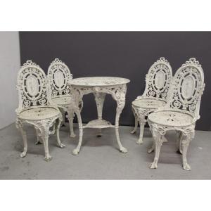 Salon de jardin en fonte à décor de femmes XXe