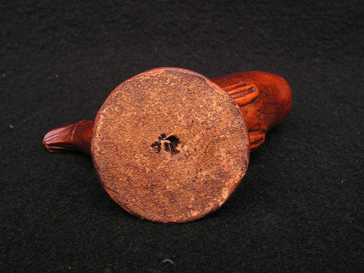 Old Carved Wooden Pyrogen Representing A Dolphin.-photo-1