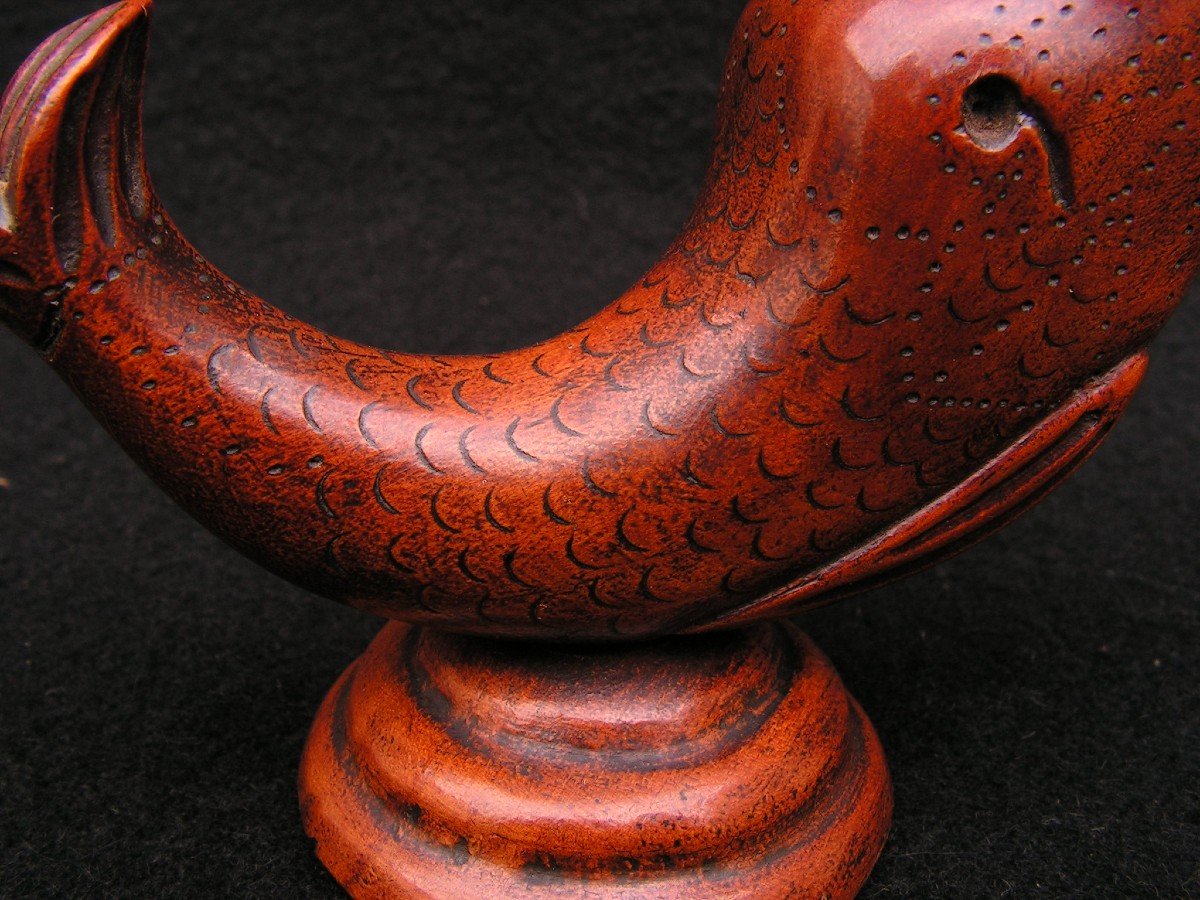 Old Carved Wooden Pyrogen Representing A Dolphin.-photo-2