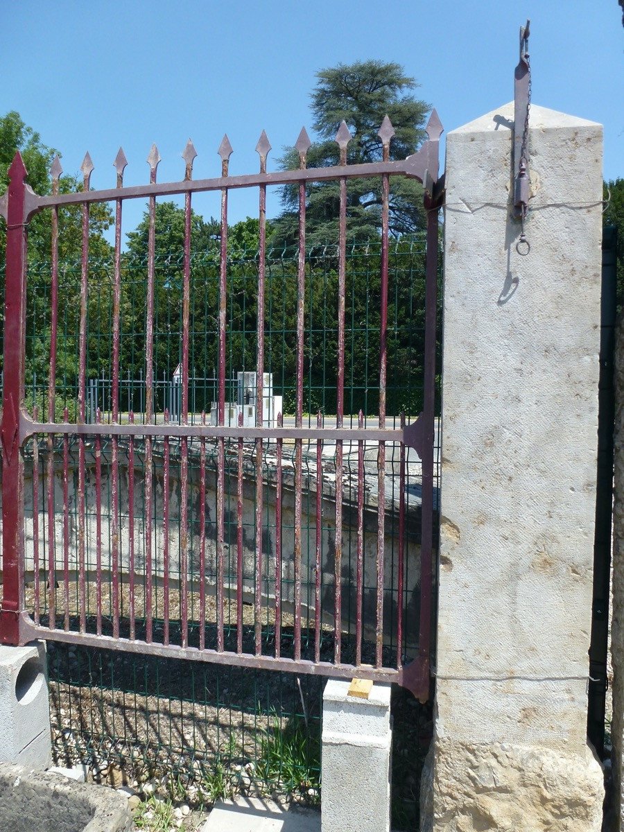 Wrought Iron Gate And Its Pair Of Pillars-photo-1