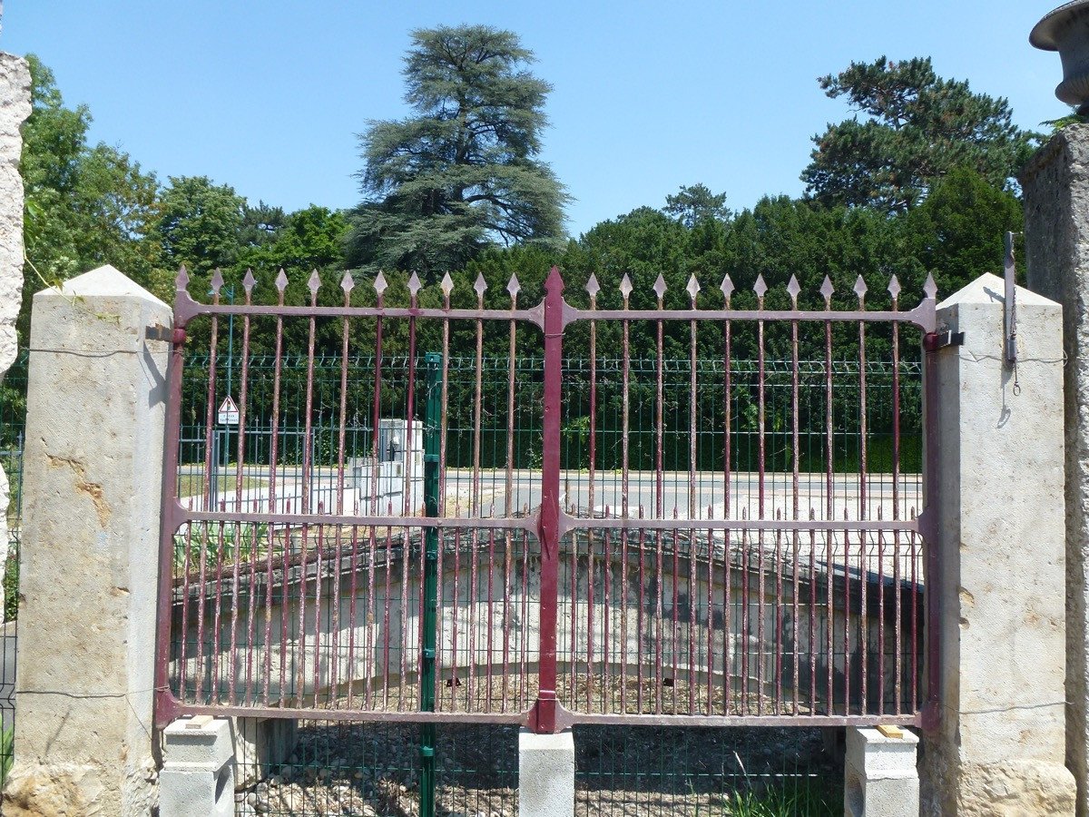 Wrought Iron Gate And Its Pair Of Pillars