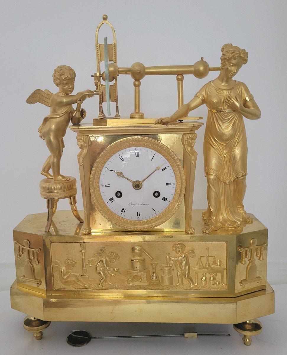 Pendule Empire En Bronze Doré signée Binjé "la découverte de l'électricité statique"