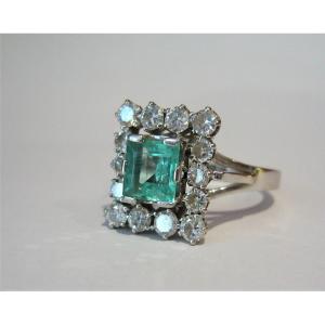 White Gold Ring Set With An Emerald And Diamonds