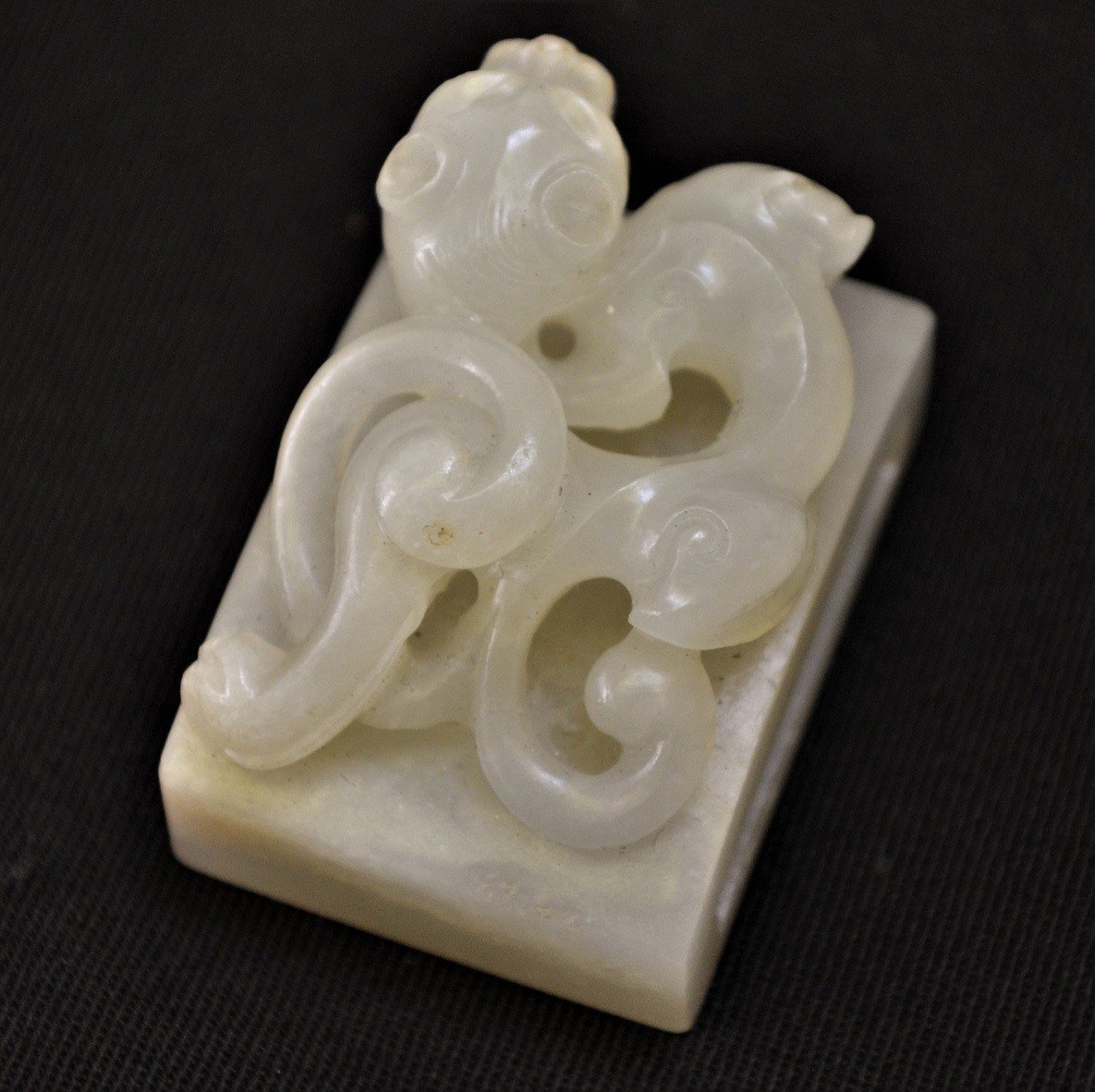 White Jade Belt Buckle. Embossed Dragon. Chinese Work From The Qing Period.