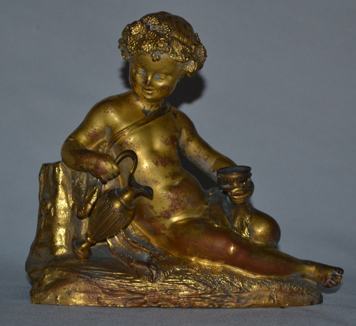 Statuette d'enfant bachique en bronze doré de style rocaille. France Paris 19° siècle.  