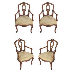 A North Italian Set Of Four Armchairs In Carved Walnut Wood. Venice, 18th Century