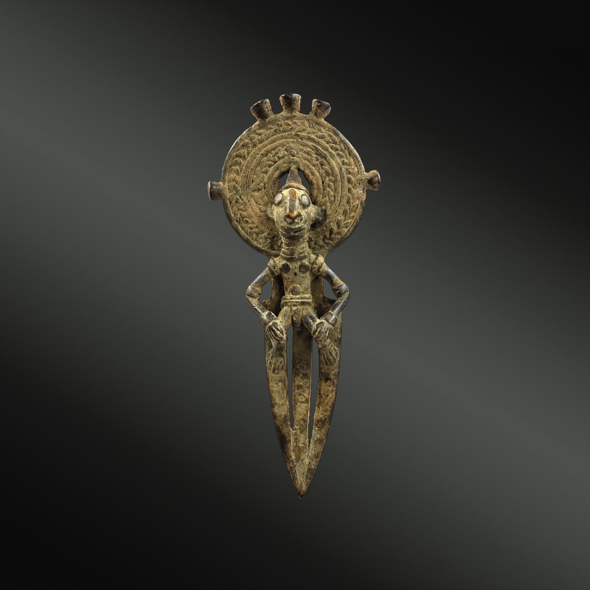 Animated Pendant Of An Anthropomorphic Character Full Face, Legs Bent, Hands Resting On