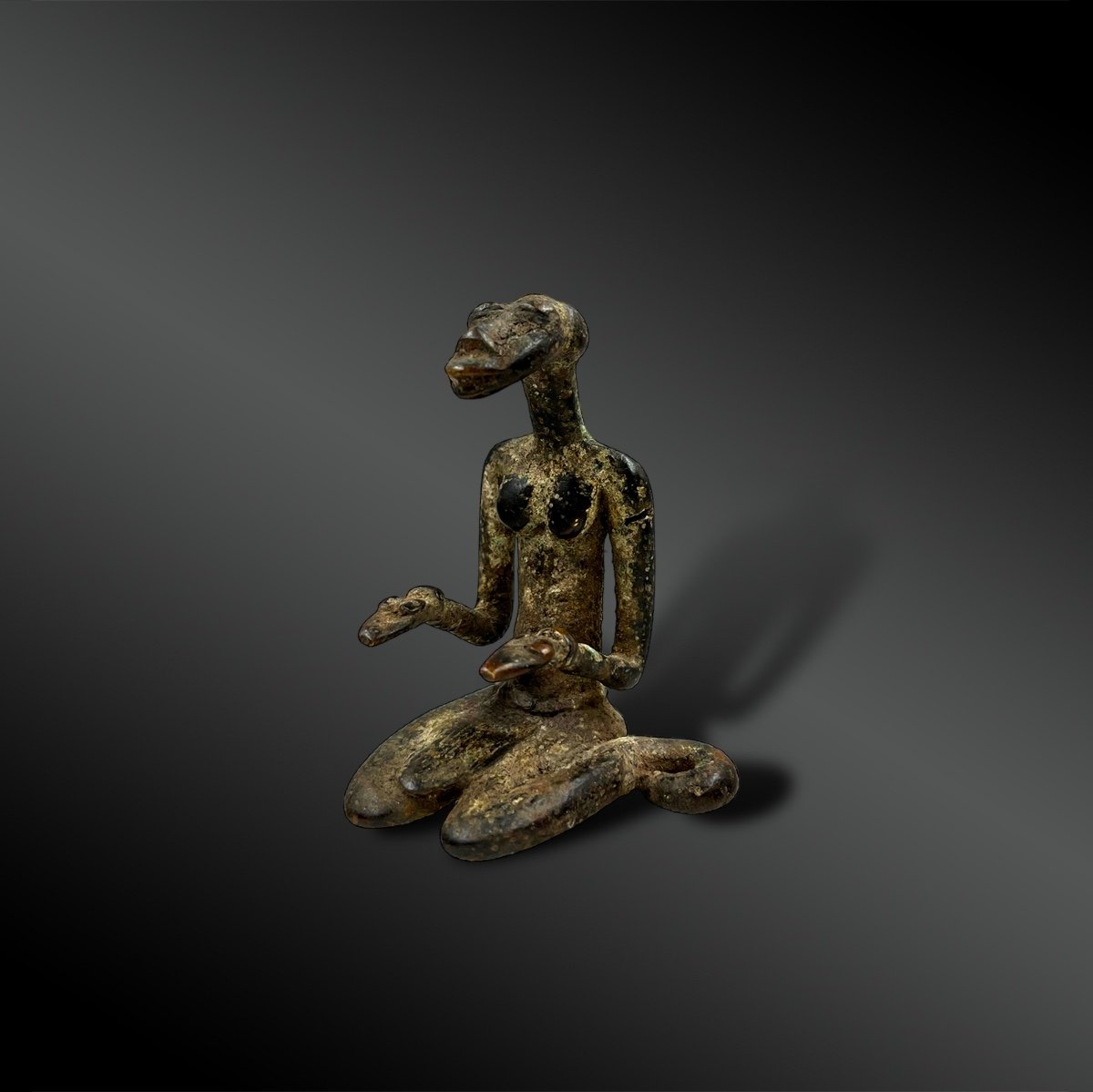 Statuette Depicting A Seated Snake Woman - Ivory Coast - Circa 1900