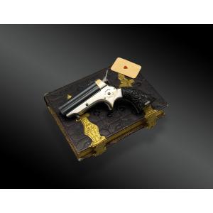 COFFRET DE JOUEUR AVEC PISTOLET SHARPS & HANKINS, QUATRE CANONS Cal. 22