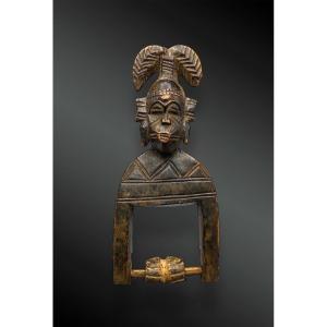 Pulley Stirrup Of A Weaving Loom Animated With A Kpeliyé'e Face Mask, Senufo Culture