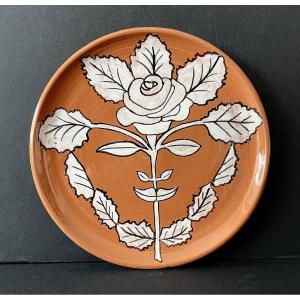 Assiette en céramique "visage fleur" par jean Marais Vallauris