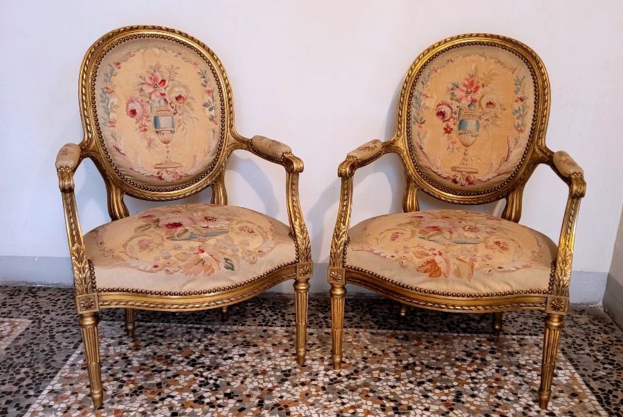 Two Gilded Louis XVI-style Armchairs