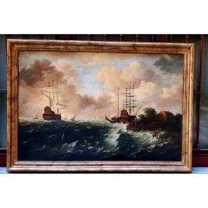 Huile sur toile représentant une marine avec des voiliers dans la tempête.