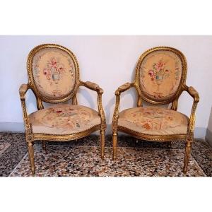 Two Gilded Louis XVI-style Armchairs