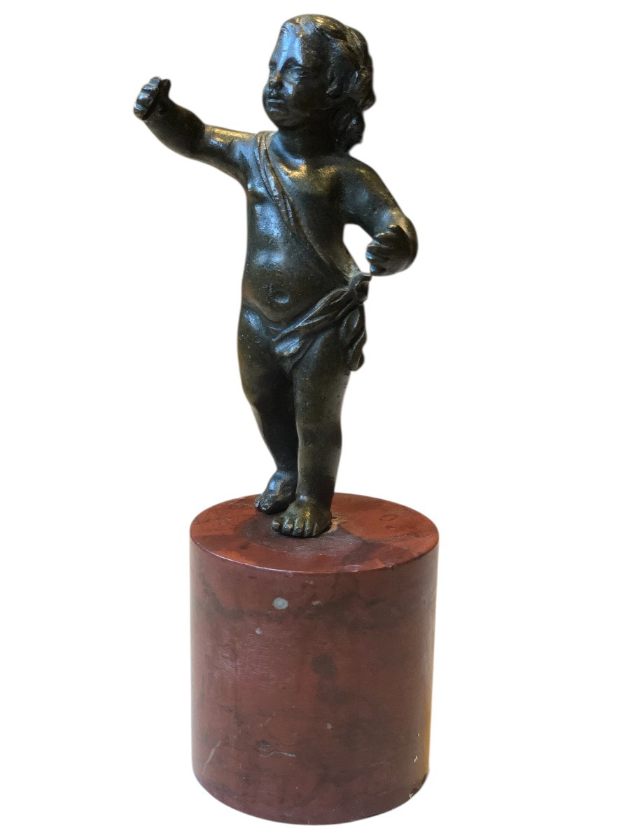 Small Bronze Statuette Of A Child On A Red Marble Base