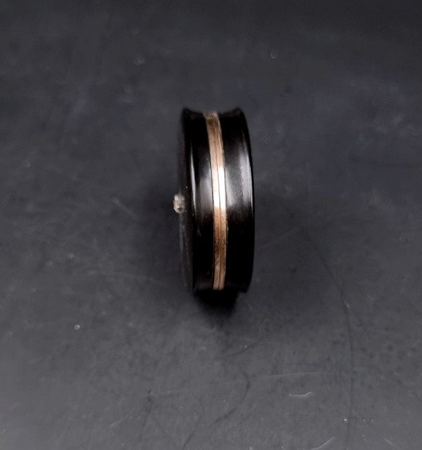 A Circular Box Made Of Composite Material, Set With A Diamond And Featuring A Gold Interior -photo-2