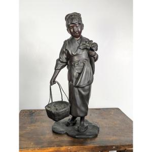 Jeune fille au panier d’anguilles - bronze fin ére Meiji ou Taisho - circa 1900-1920