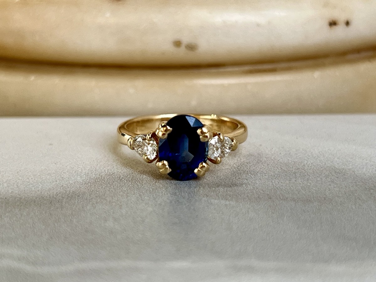 Yellow Gold Ring, 2-carat Oval Sapphire And Pear-shaped Diamonds Totaling 0.80 Carats
