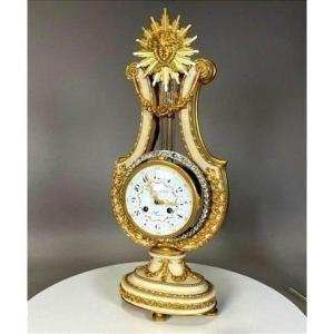 Pendule lyre en bronze doré et marbre blanc
