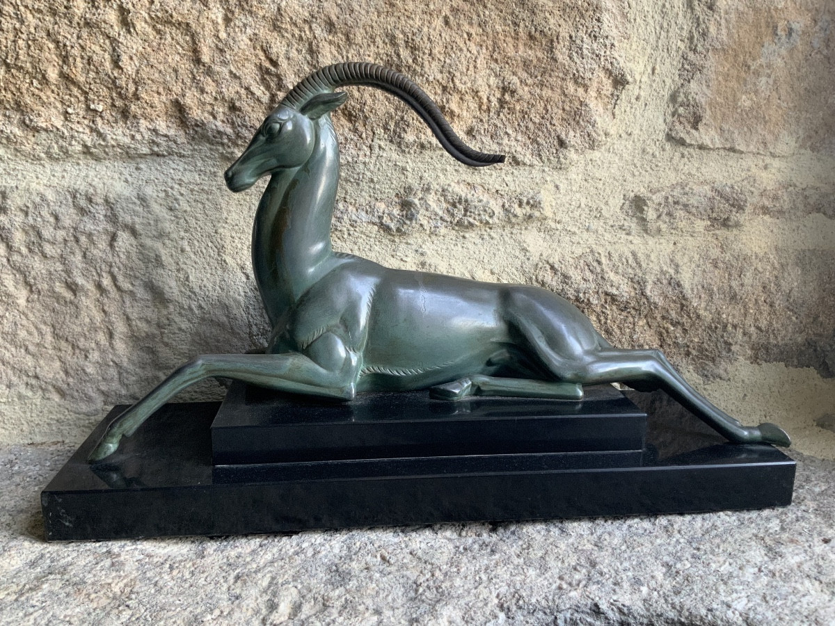 Art Deco Statue Of A Reclining Antelope. Signed Fayral, Pseudonym Of Pierre Le Faguays