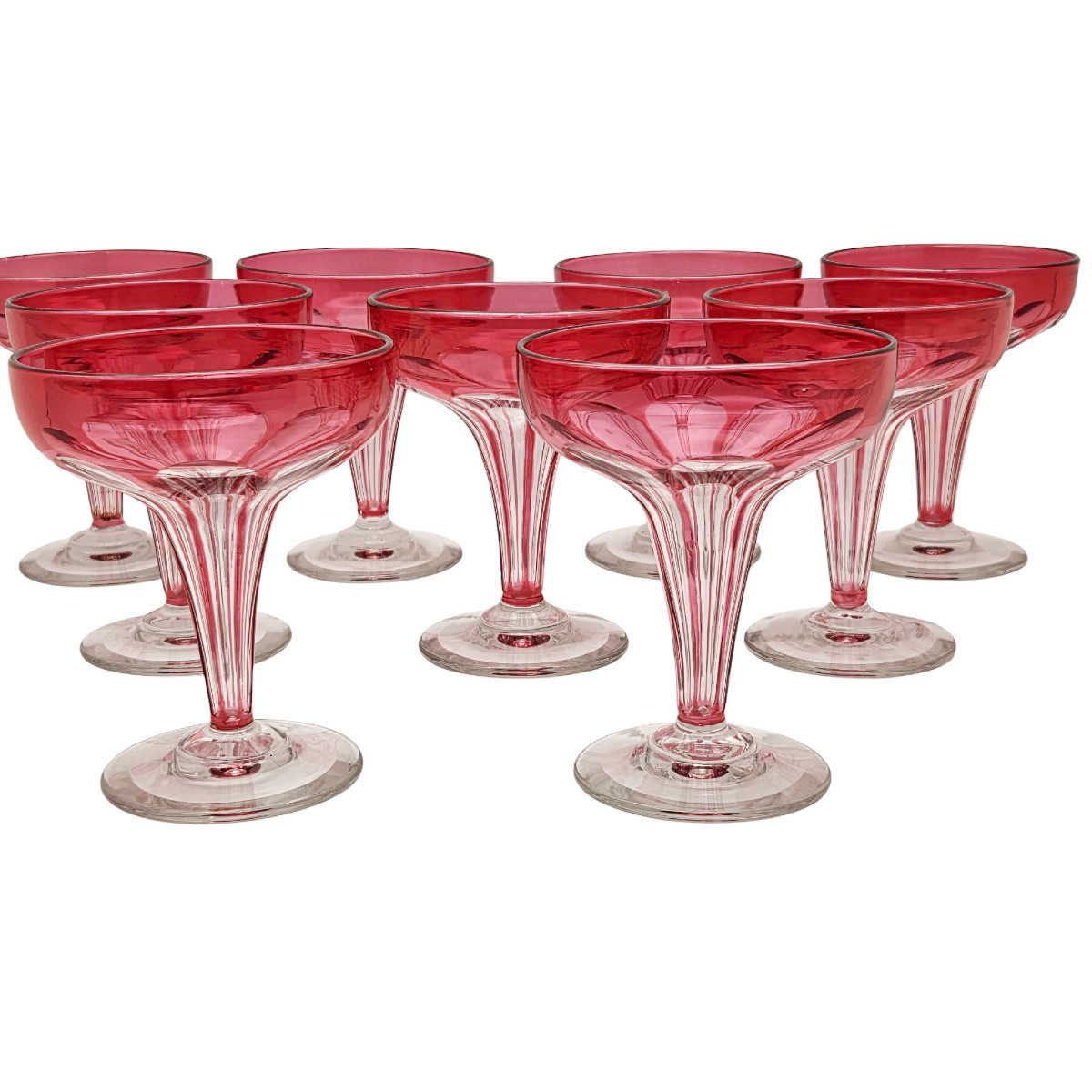  Série de 9 coupes champenoises en cristal de Baccarat, doublées roses.