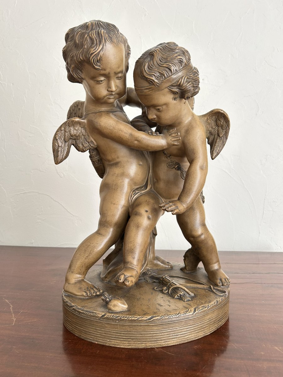 Terre cuite " deux amours se disputant un cœur "