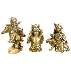 Trois bouddhas rieurs en bronze poli