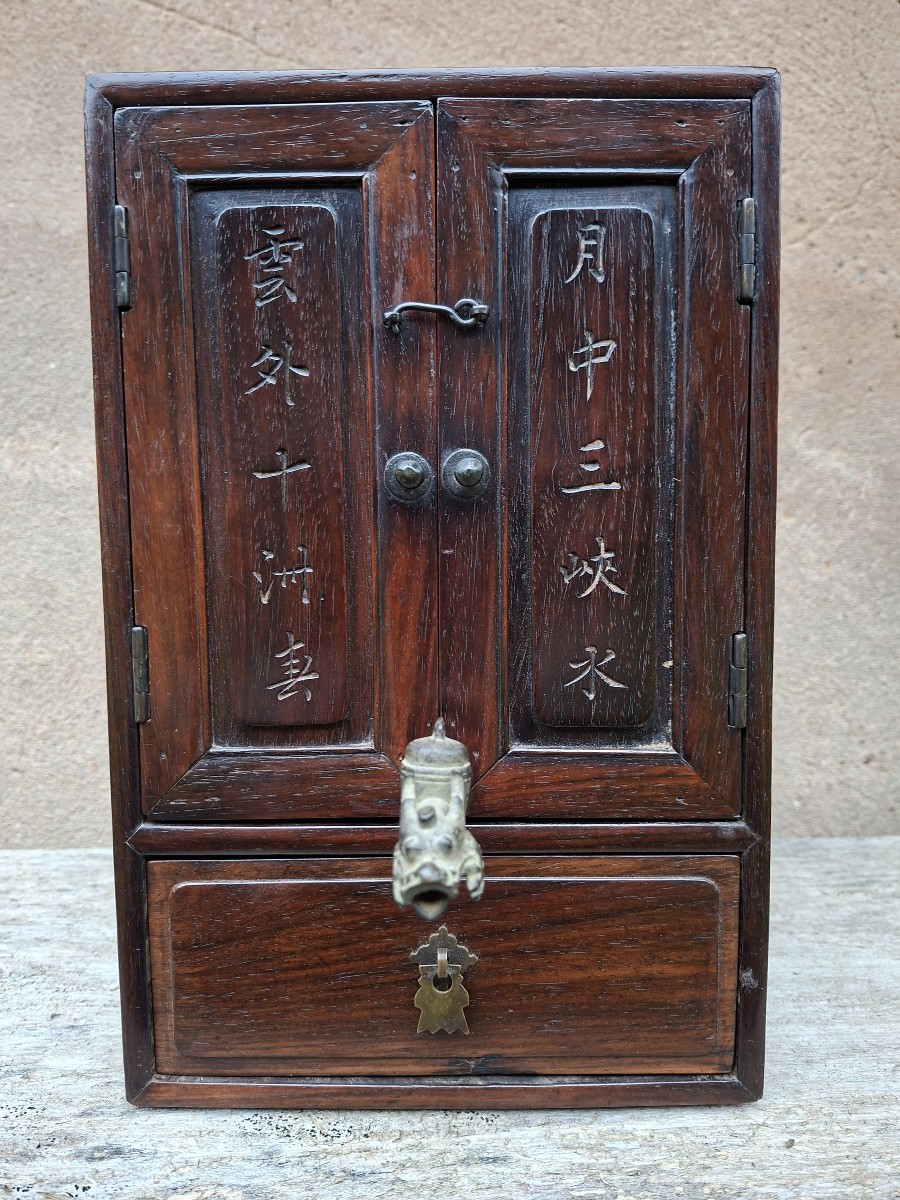 Zitan Cabinet With A Shiwan Pot, 19th Century China
