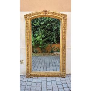 Miroir ancien doré du XIXe siècle avec couronnement en arcade