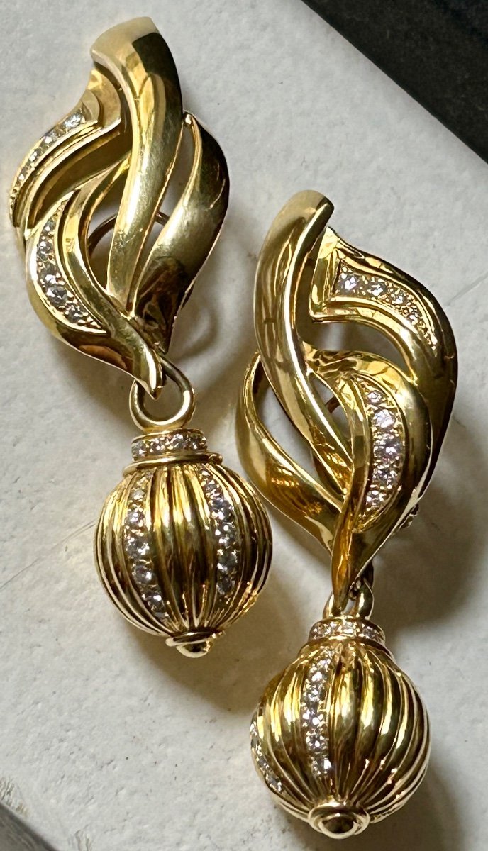 Pair Of Gold And Shiny Earrings