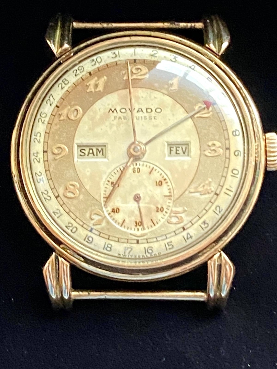 Montre art déco Movado triple calendrier en or 18 carats 