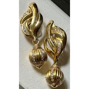 Pair Of Gold And Shiny Earrings
