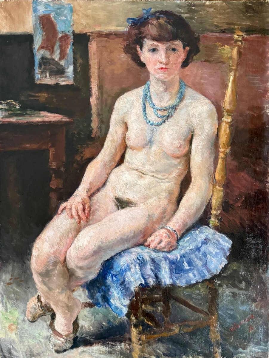 Young Naked Woman With Blue Necklace