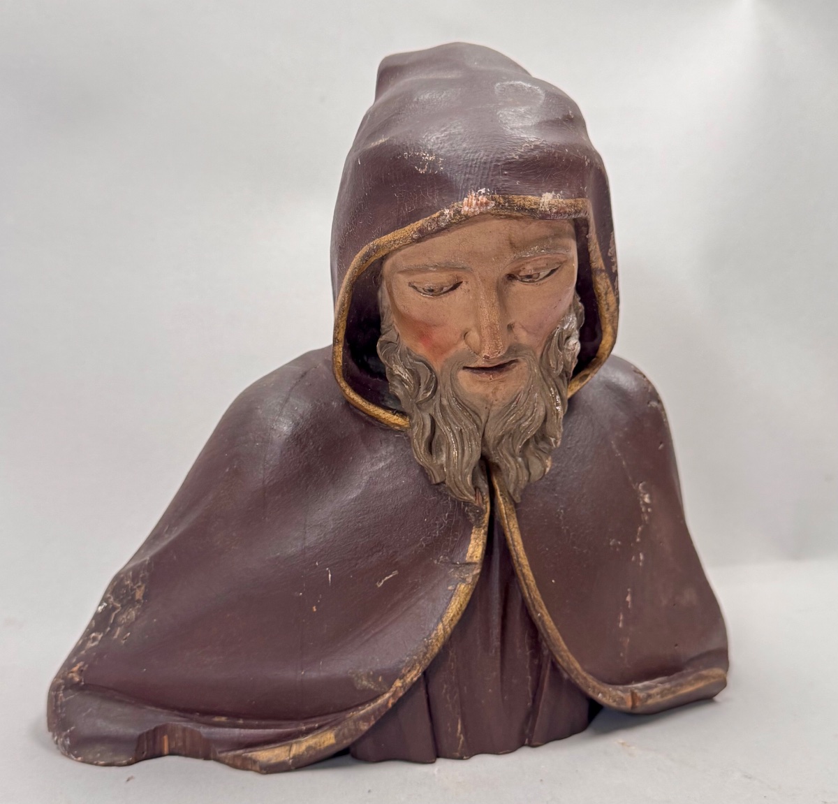 Wood Carving Of A Bust Of A Monk In Robes