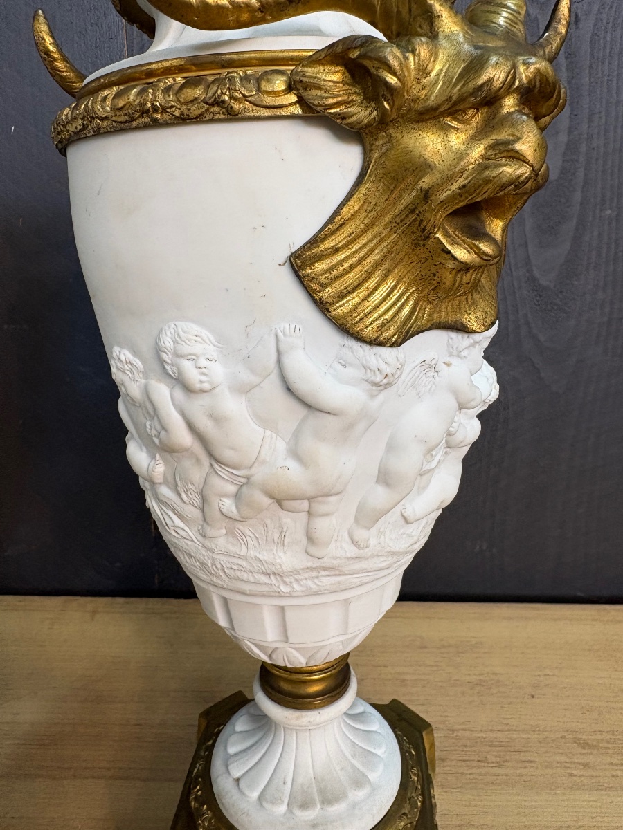 Pair Of Bisque And Gilded Bronze Amphorae Decorated With Cherubs And Ram's Heads -photo-2