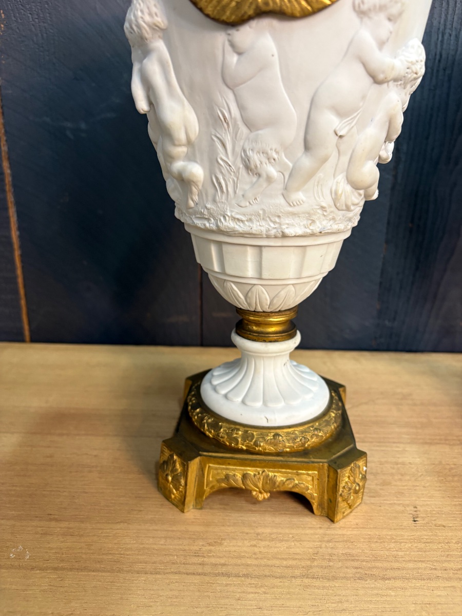 Pair Of Bisque And Gilded Bronze Amphorae Decorated With Cherubs And Ram's Heads -photo-6